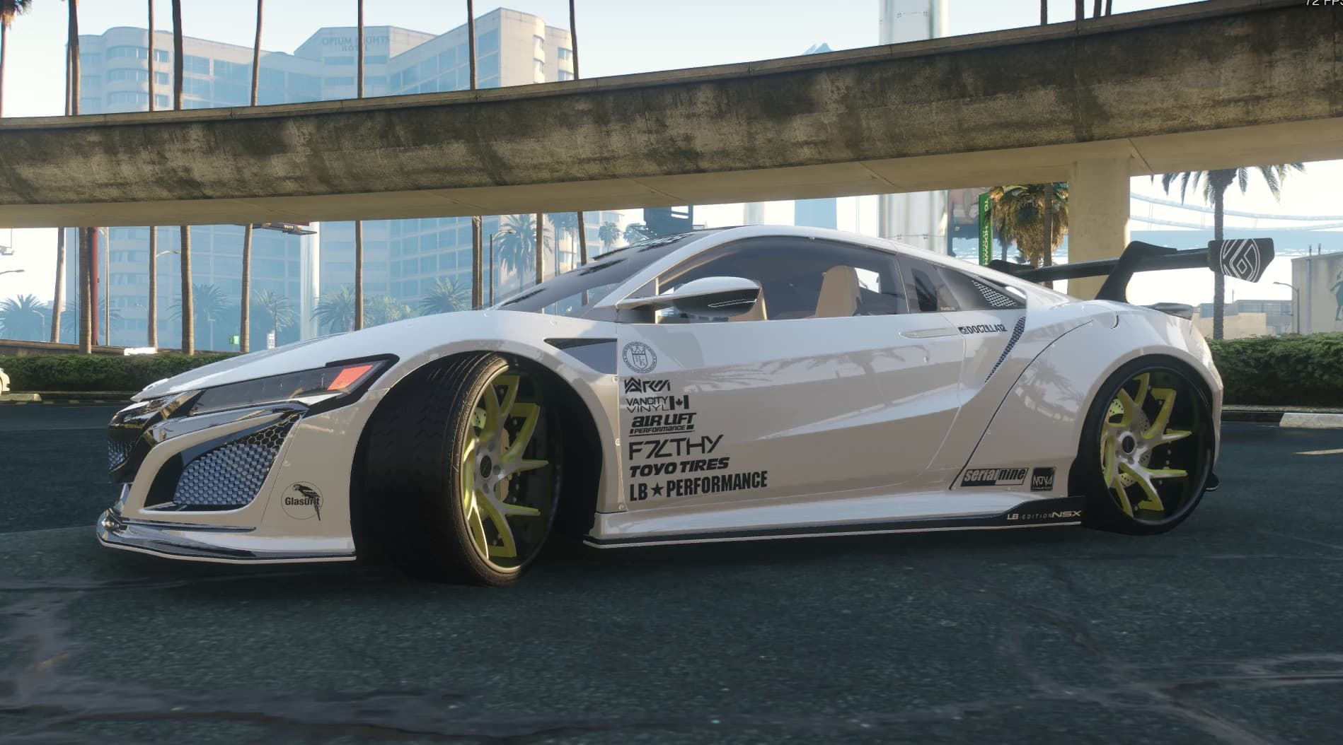 Perfil lateral bajo un paso elevado con los faldones LB Edition NSX, la columna completa de patrocinadores y neumáticos estirados sobre llantas lima