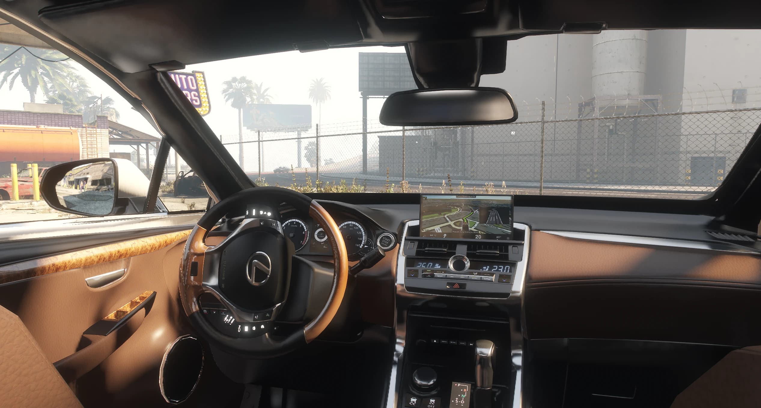 Interior del RX 450h con cuero caramelo, volante con madera y la pantalla de navegación