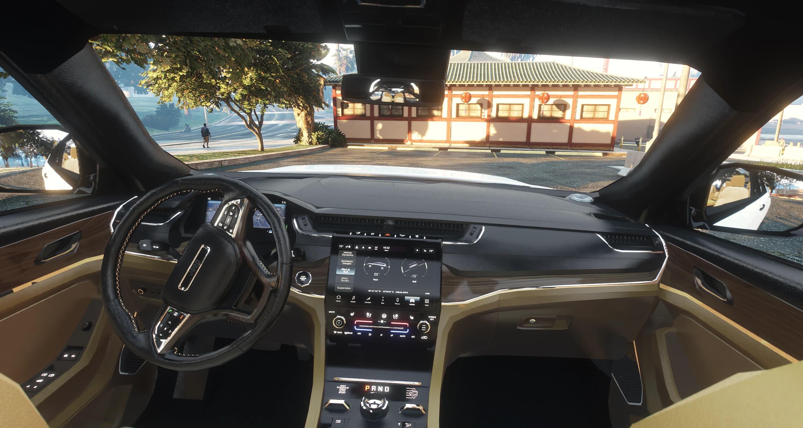 Interior del Grand Cherokee en negro sobre beis con madera, cuadro digital y la pantalla táctil mostrando páginas de off road