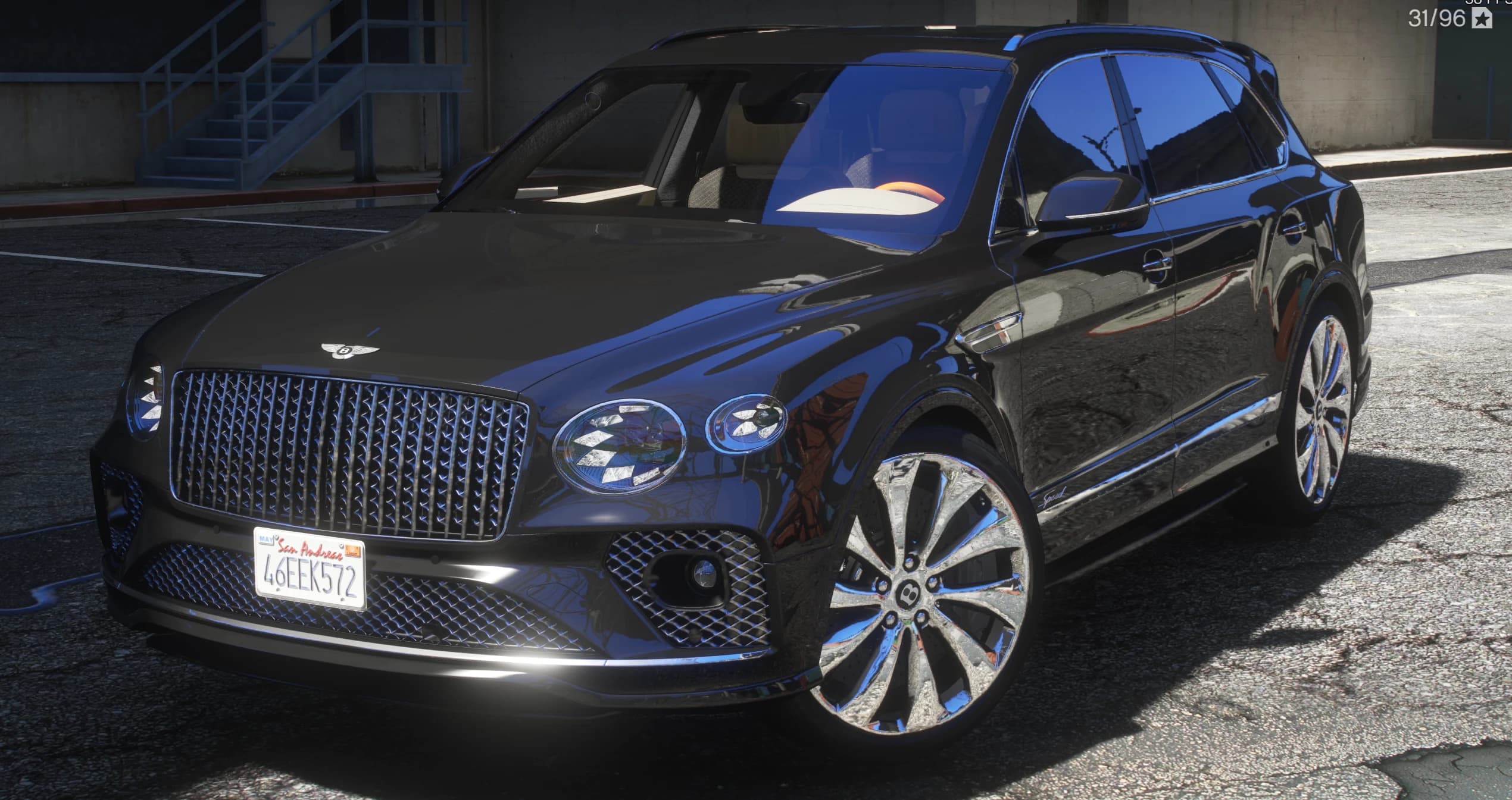 Vista frontal en tres cuartos del Bentayga negro con su parrilla cromada de malla, el emblema de la B alada, faros ovalados y llantas pulidas multirradio