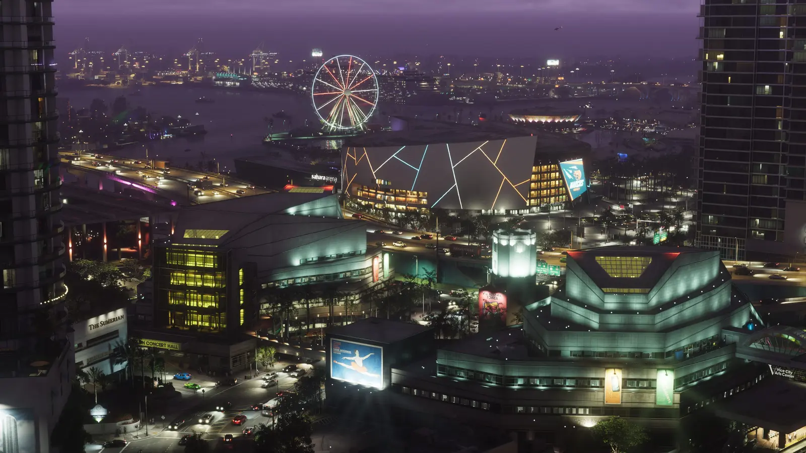 Vista aérea nocturna del centro de Vice City, con el Sahara Arena iluminado, una noria junto al agua y el tráfico circulando por la autopista elevada